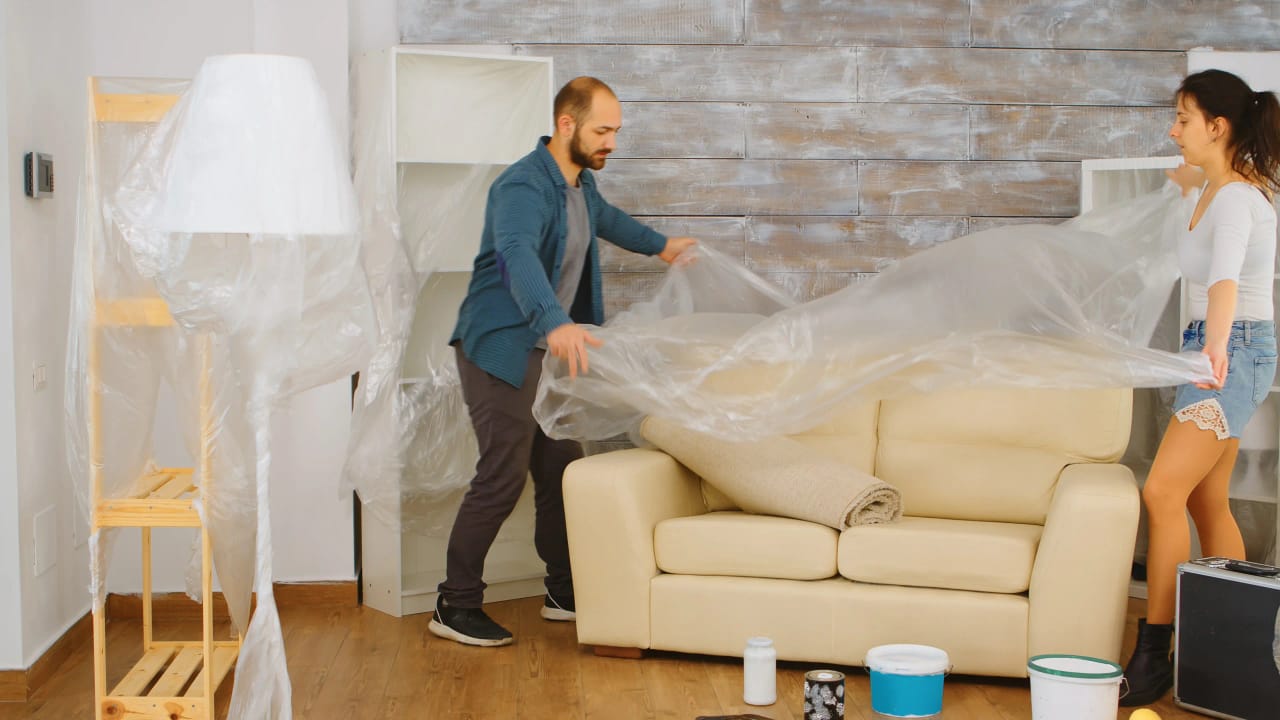 Furniture wrapped and prepared during a move-out restoration