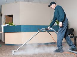 Maseeng technician steam cleaning a carpet